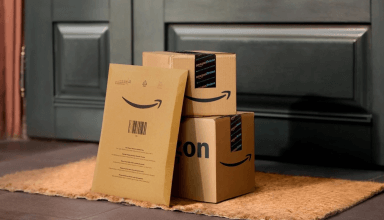 Packages of different sizes sit on a doorstep. 