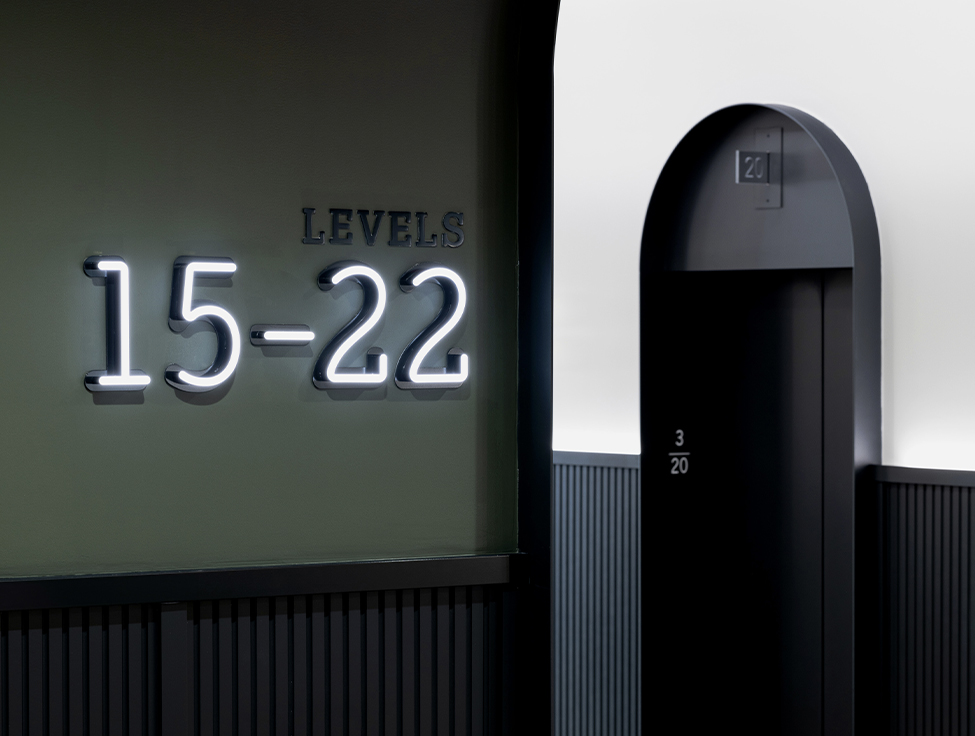 An entryway leading to elevator doors.