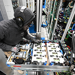 children with A technician is shown working on a piece of machinery.