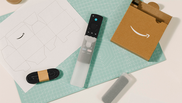 An Amazon device is shown from above on a cluttered table.