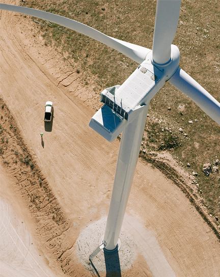 A view from above shows the top of a wind turbine. 