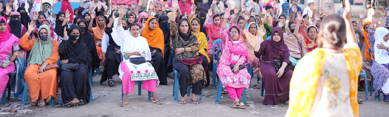 A group of people raising their hands. 