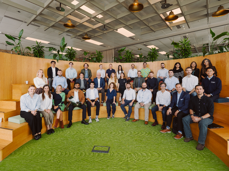 A large group of people gather for a photo. 