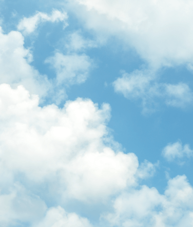 A blue sky with white, fluffy clouds. 