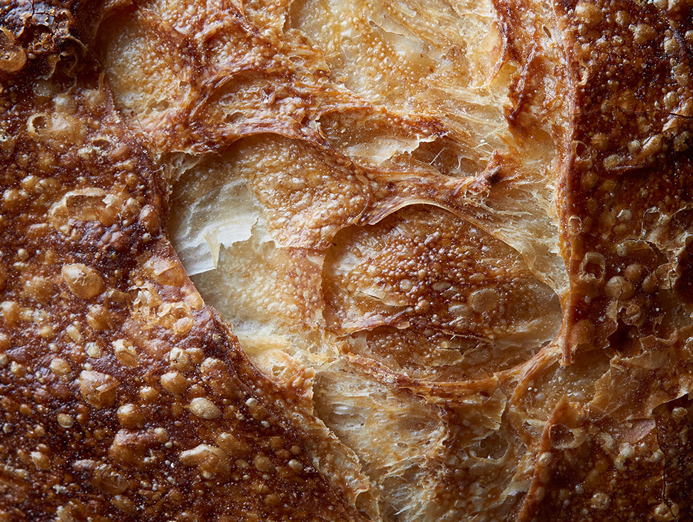 A close-up image of freshly baked bread is shown below text that says: "Reducing food waste"