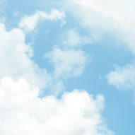 A blue sky with white, fluffy clouds. 