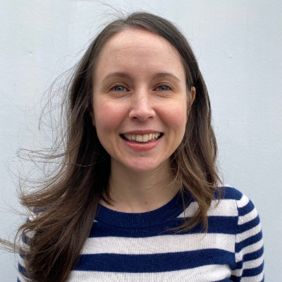 A woman smiling.