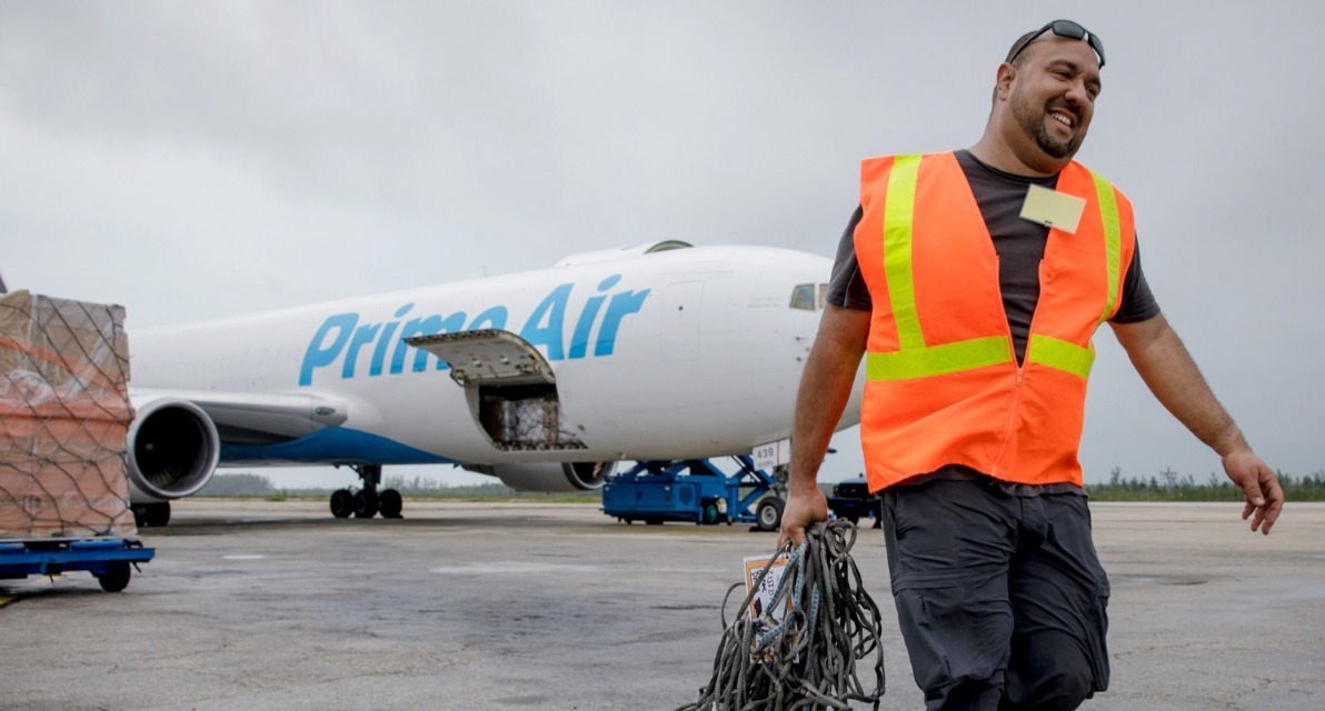 Abe Diaz, head of Amazon's Disaster Relief team, unloads emergency supplies from a Prime Air plane.