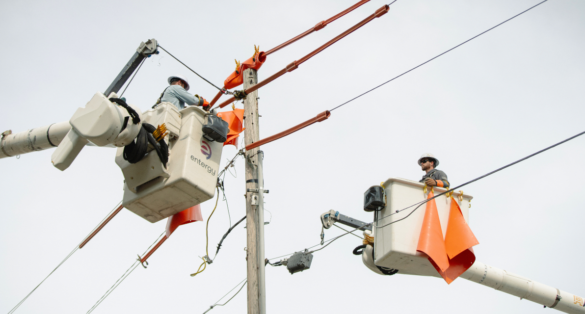 Crew members from Entergy Mississippi conduct live line maintenance in the field. 