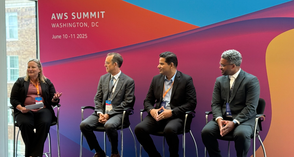 A group of people participate in a panel discussion. 