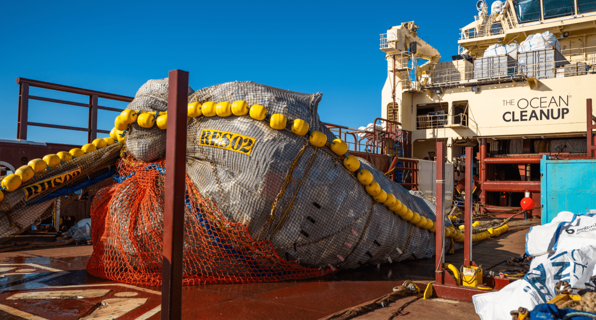 A gigantic bag of trash is shown on the deck of a ship used by The Ocean Cleanup. 