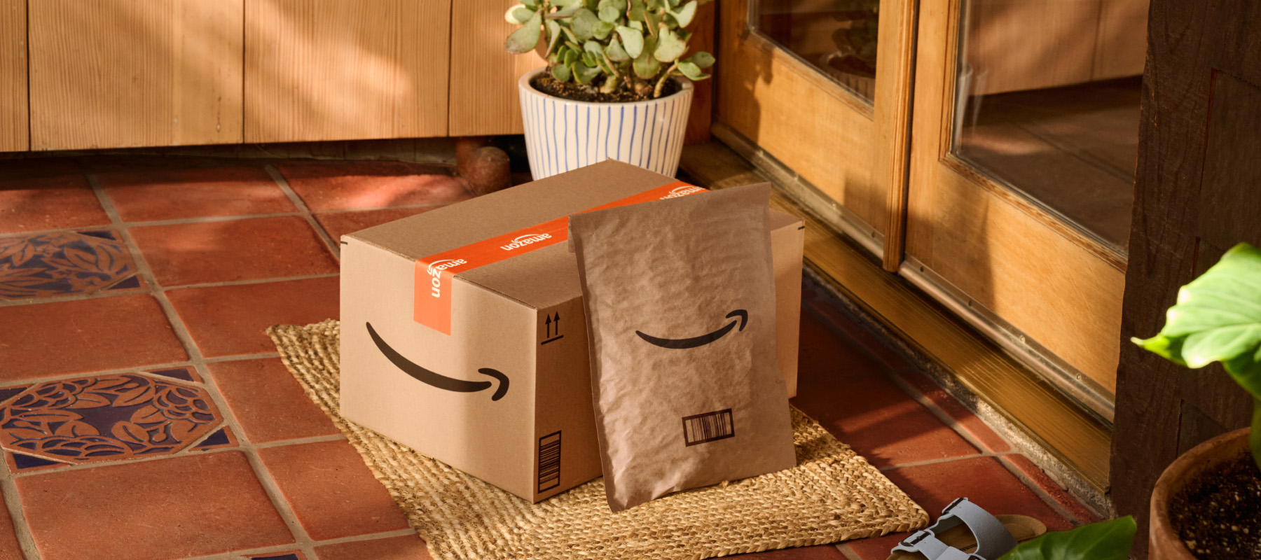 Boxes sit on a doorstep. 